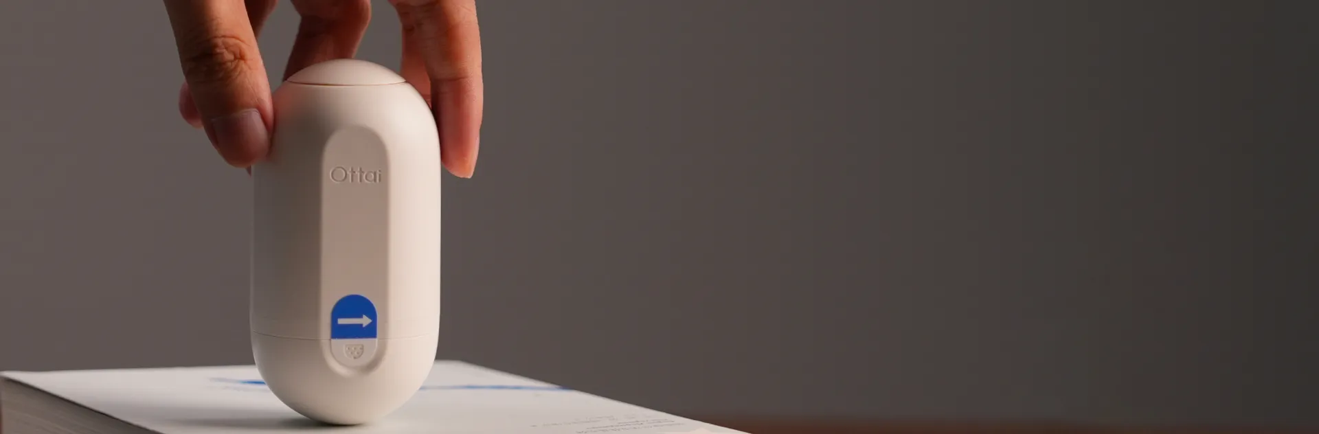 Holding an Ottai applicator on the table